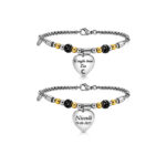Bracciale per la zia personalizzato in acciaio inox con dettagli bicolore e ciondolo a cuore. L’incisione fronte e retro permette di aggiungere una dedica, un nome, una data o un simbolo speciale.